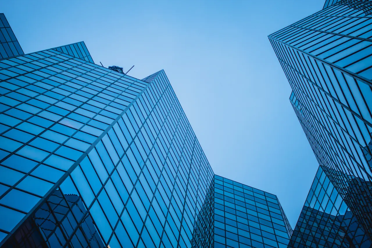Glass office towers seen from below